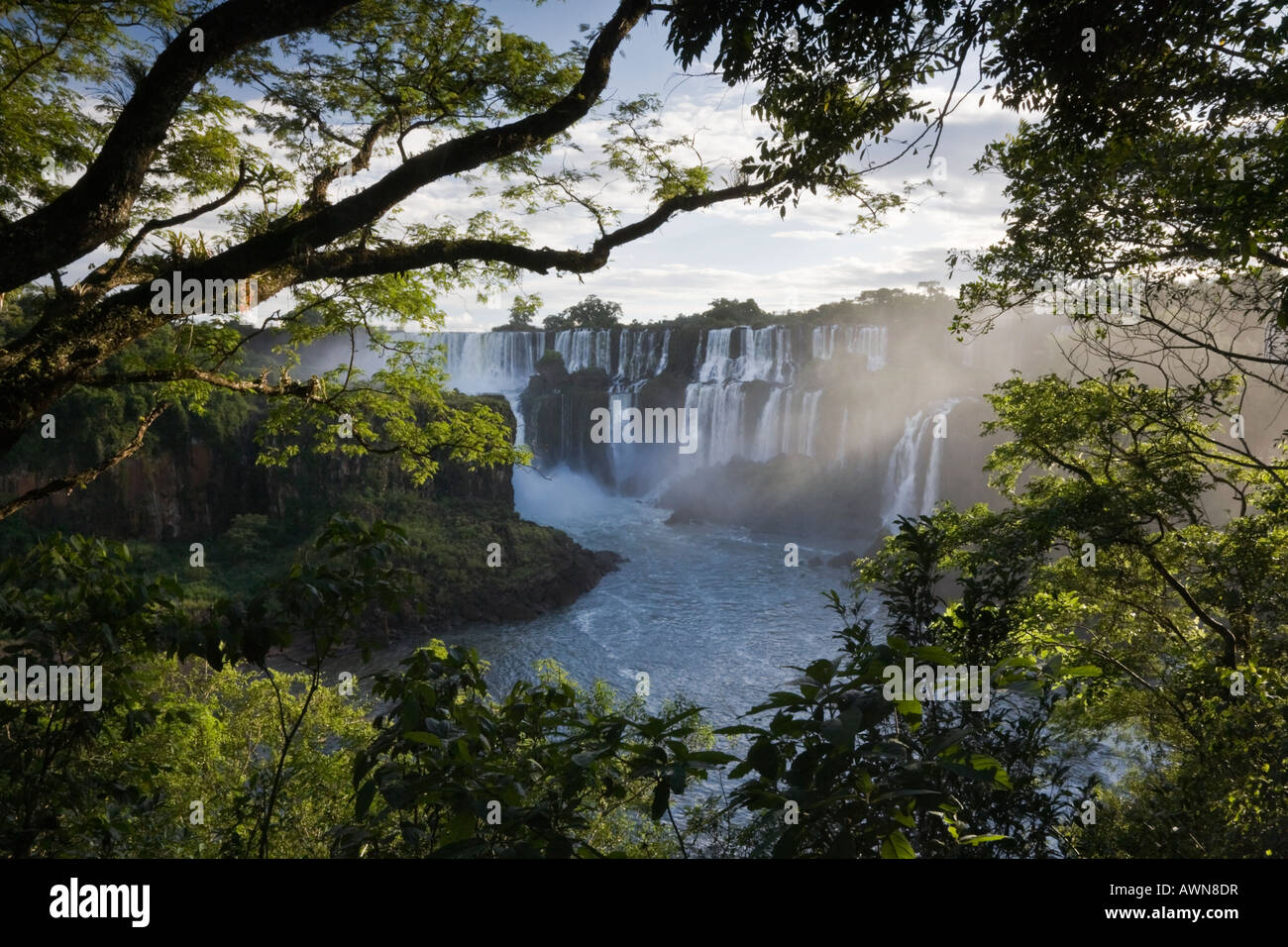 Gentle streaming light on the stunning Iguazu Falls of Argentina, Brazil and Paraguay Stock Photo