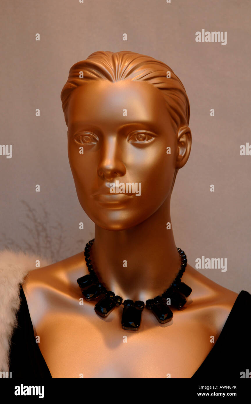 Bronze-coloured mannequin wearing black necklace Stock Photo