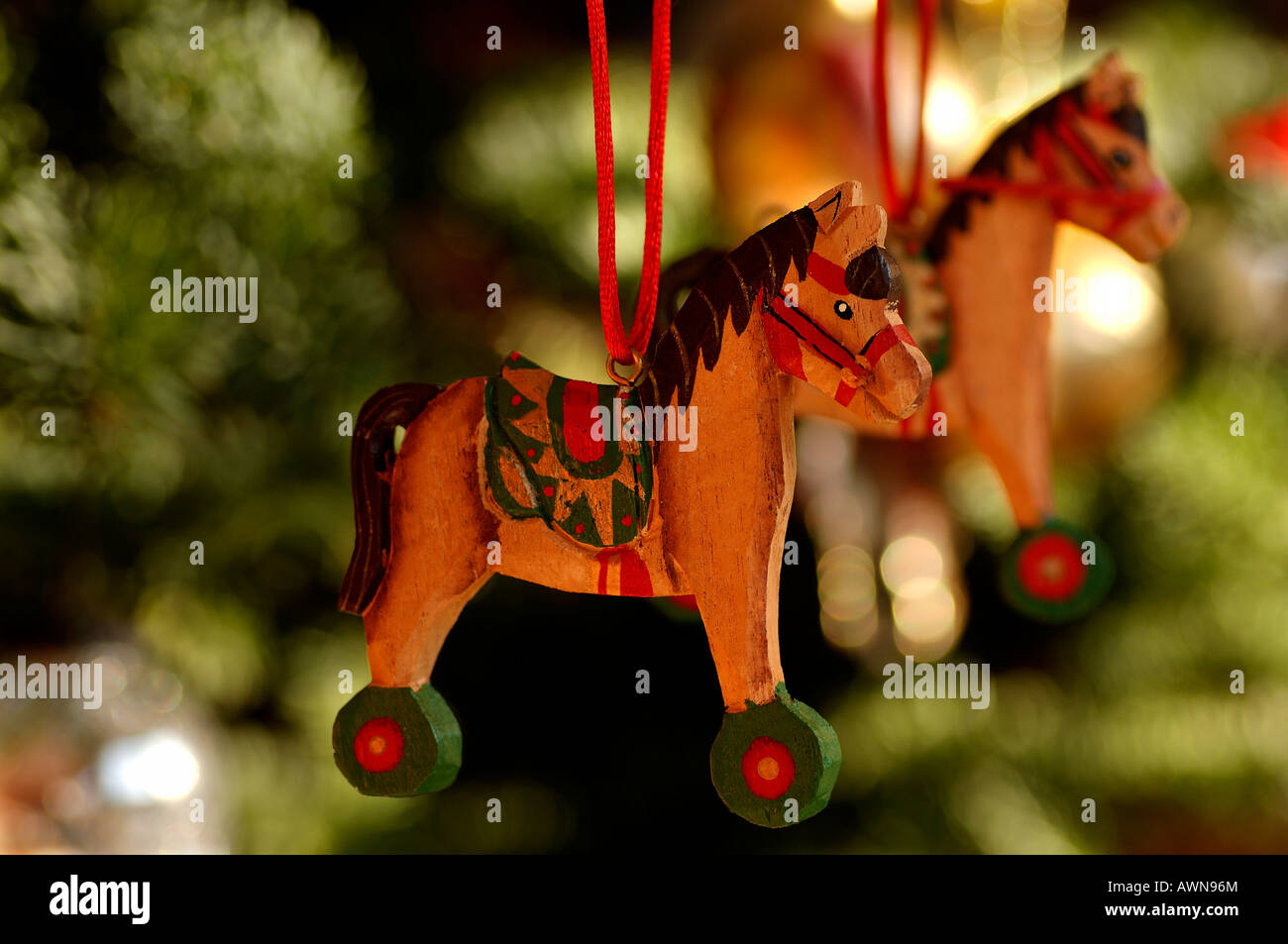 Colourful wooden horses, Christmas ornaments hanging in tree Stock Photo Alamy