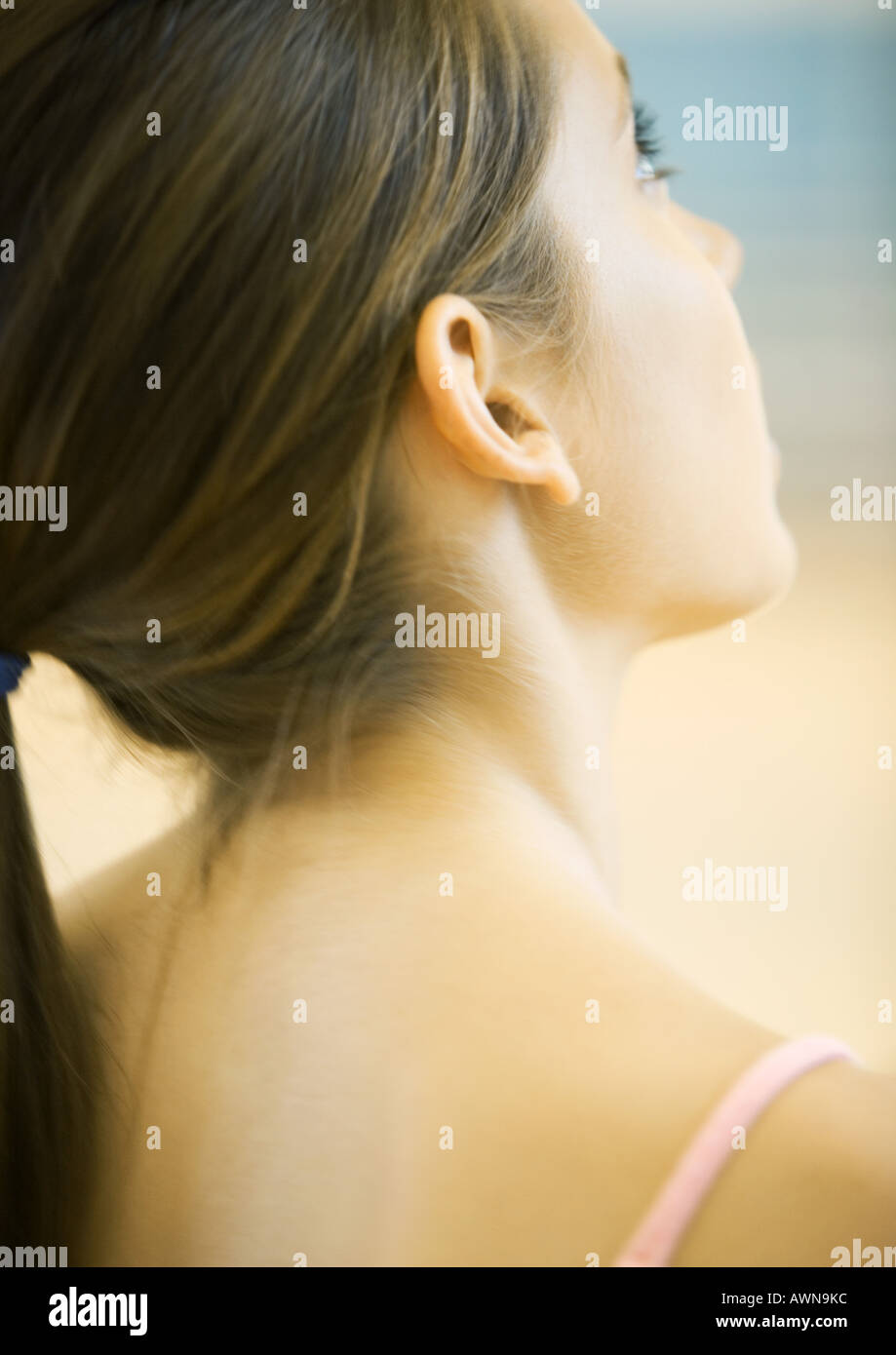 Teen girl, close-up of head and shoulders, rear view Stock Photo