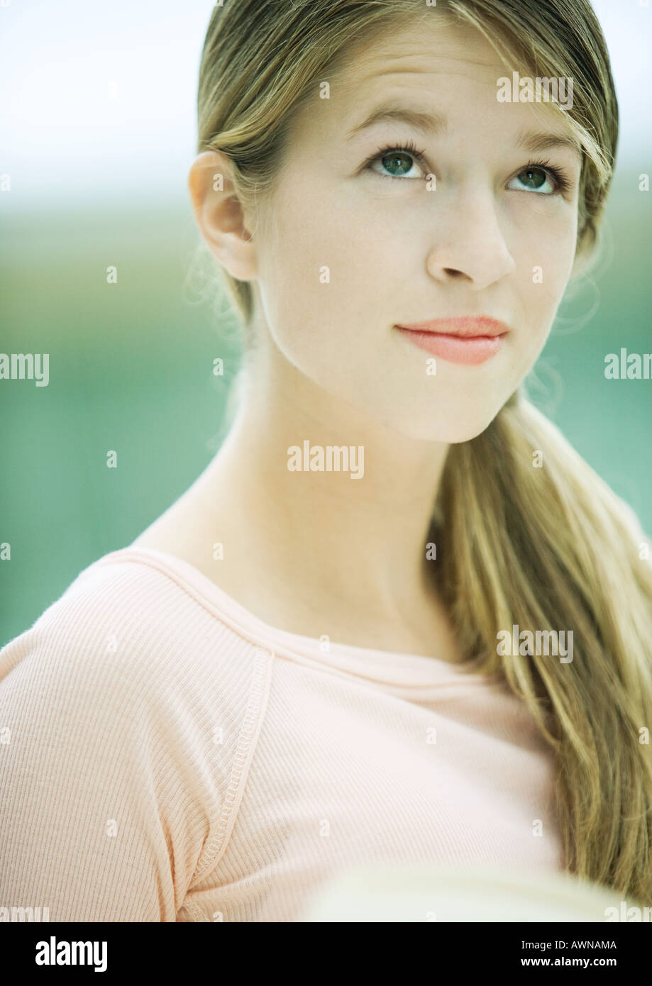 Teenage girl, raising eyebrows, portrait Stock Photo