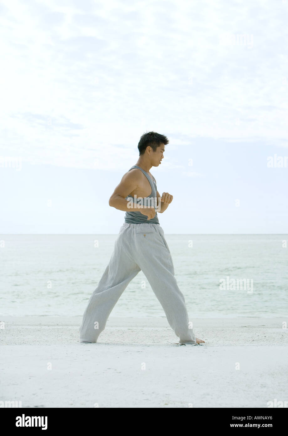 Focused young man stretching hi-res stock photography and images - Alamy