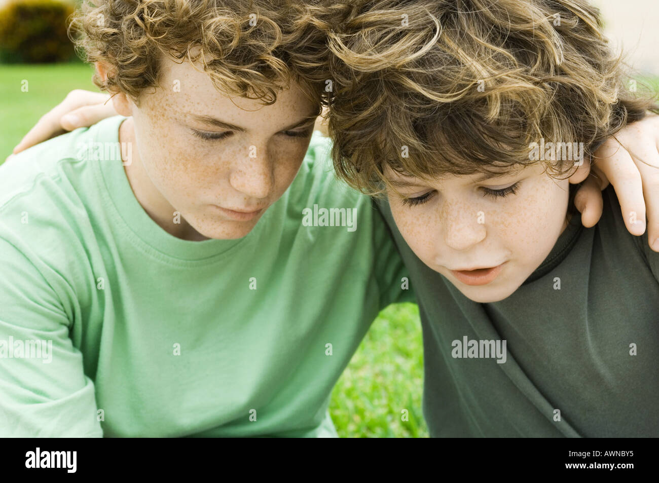 Two boys, arms around each other's shoulders Stock Photo Alamy