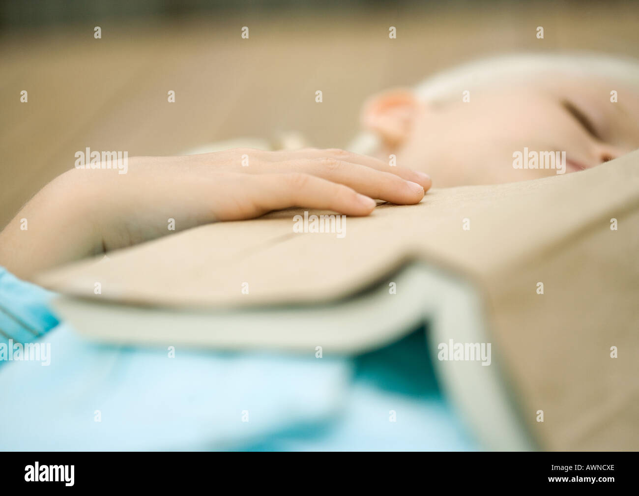 Girl sleeping with book on chest Stock Photo Alamy