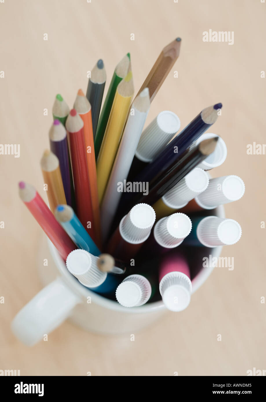Mug full of colored pencils and markers, high angle view Stock Photo