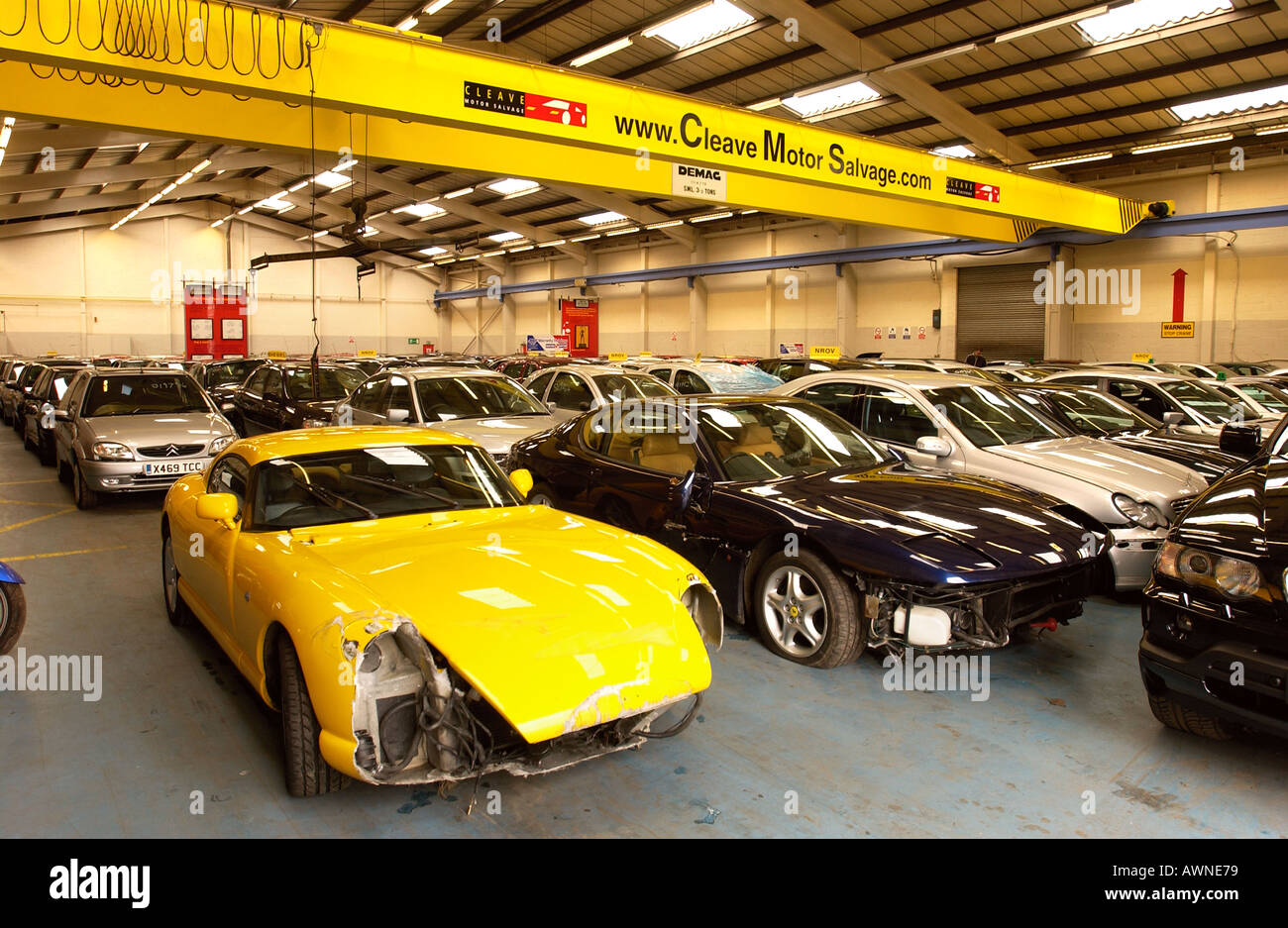 A YELLOW TVR CERBERA AT CLEAVE MOTOR SALVAGE IN GLOUCESTER UK Stock Photo
