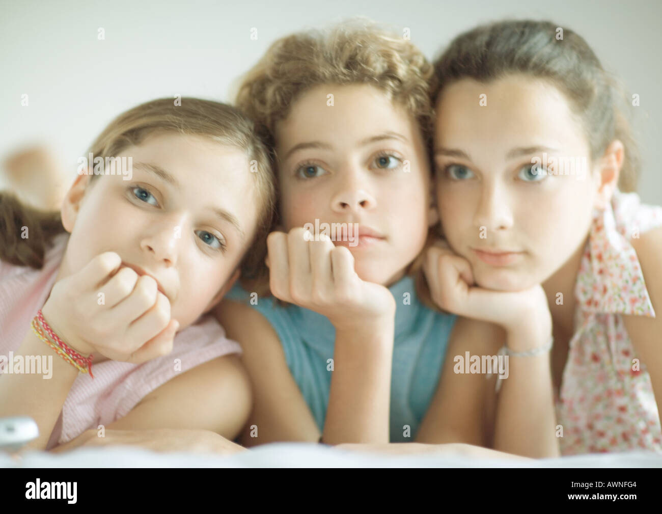 Preteen girl lying on stomach hi-res stock photography and images - Alamy