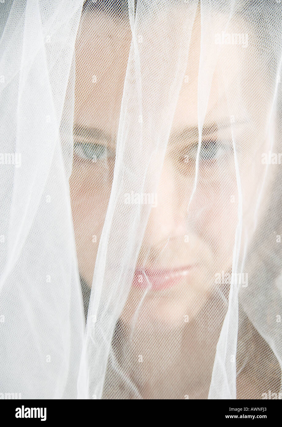 Preteen girl wearing wedding veil Stock Photo Alamy
