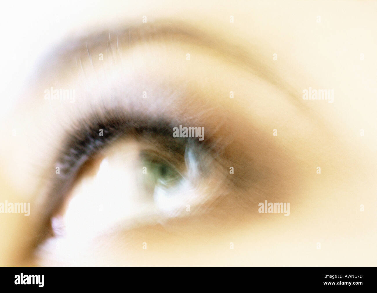 Woman's eye looking away, blurred close up. Stock Photo