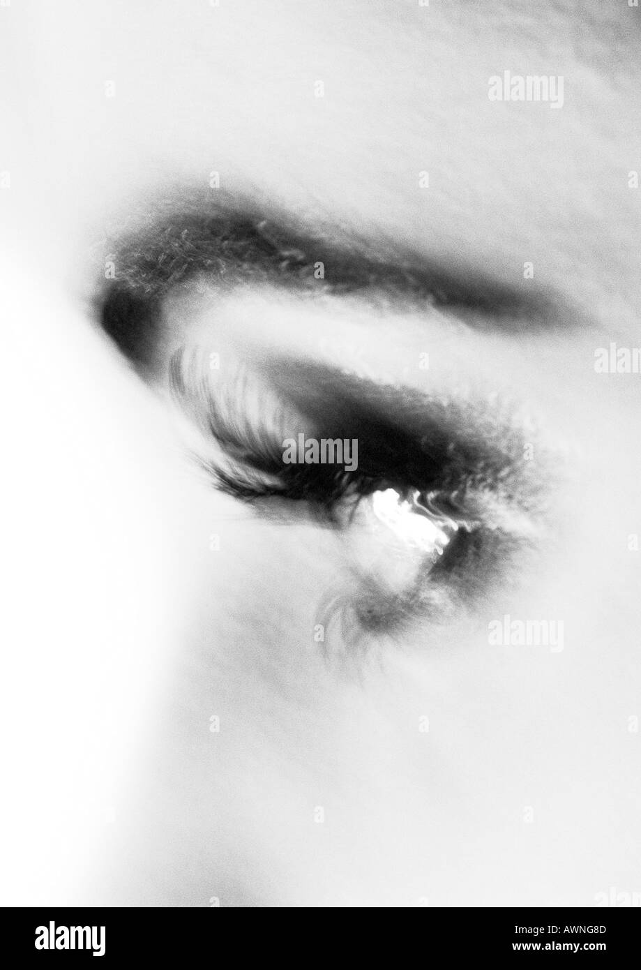 Partial view of woman's face, side view, blurred black and white. Stock Photo