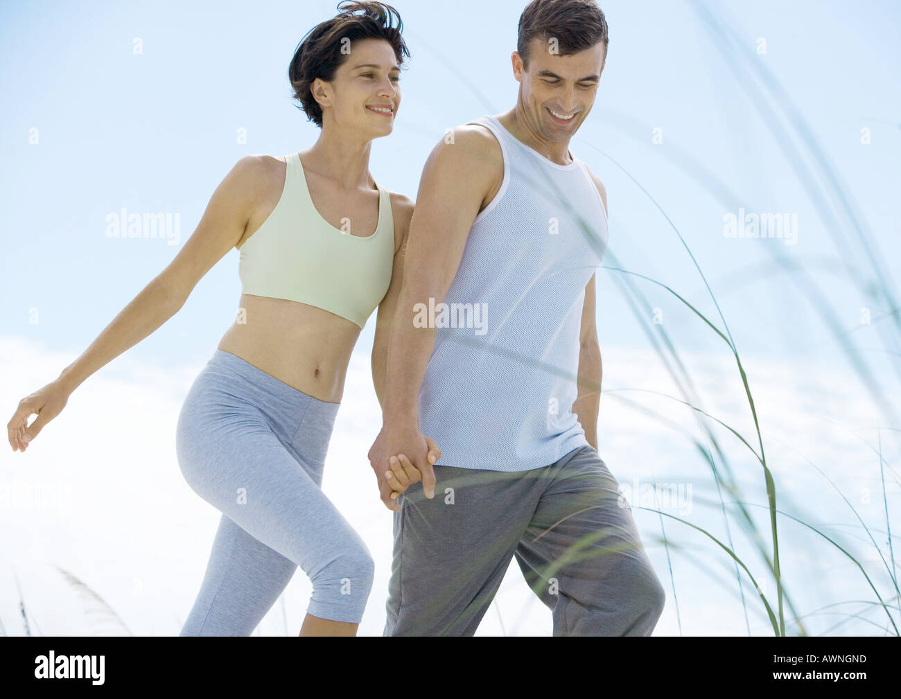 Couple walking in exercise clothes Stock Photo Alamy