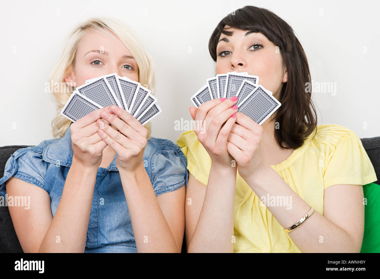 Two women playing cards Stock Photo Alamy