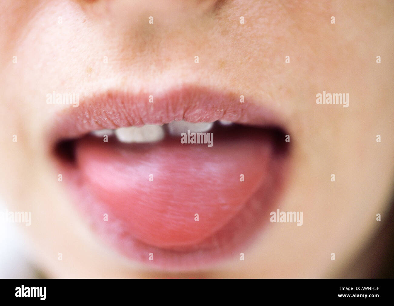 Close up of woman's mouth with tongue sticking out Stock Photo Alamy