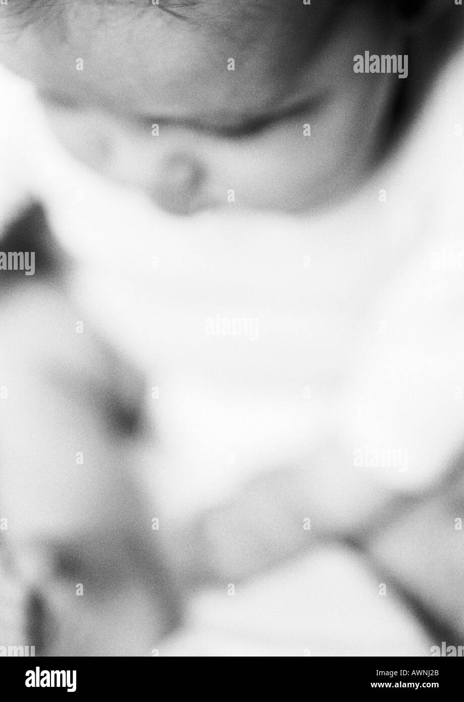 Baby, head down, view from above, closeup, B&W Stock Photo Alamy
