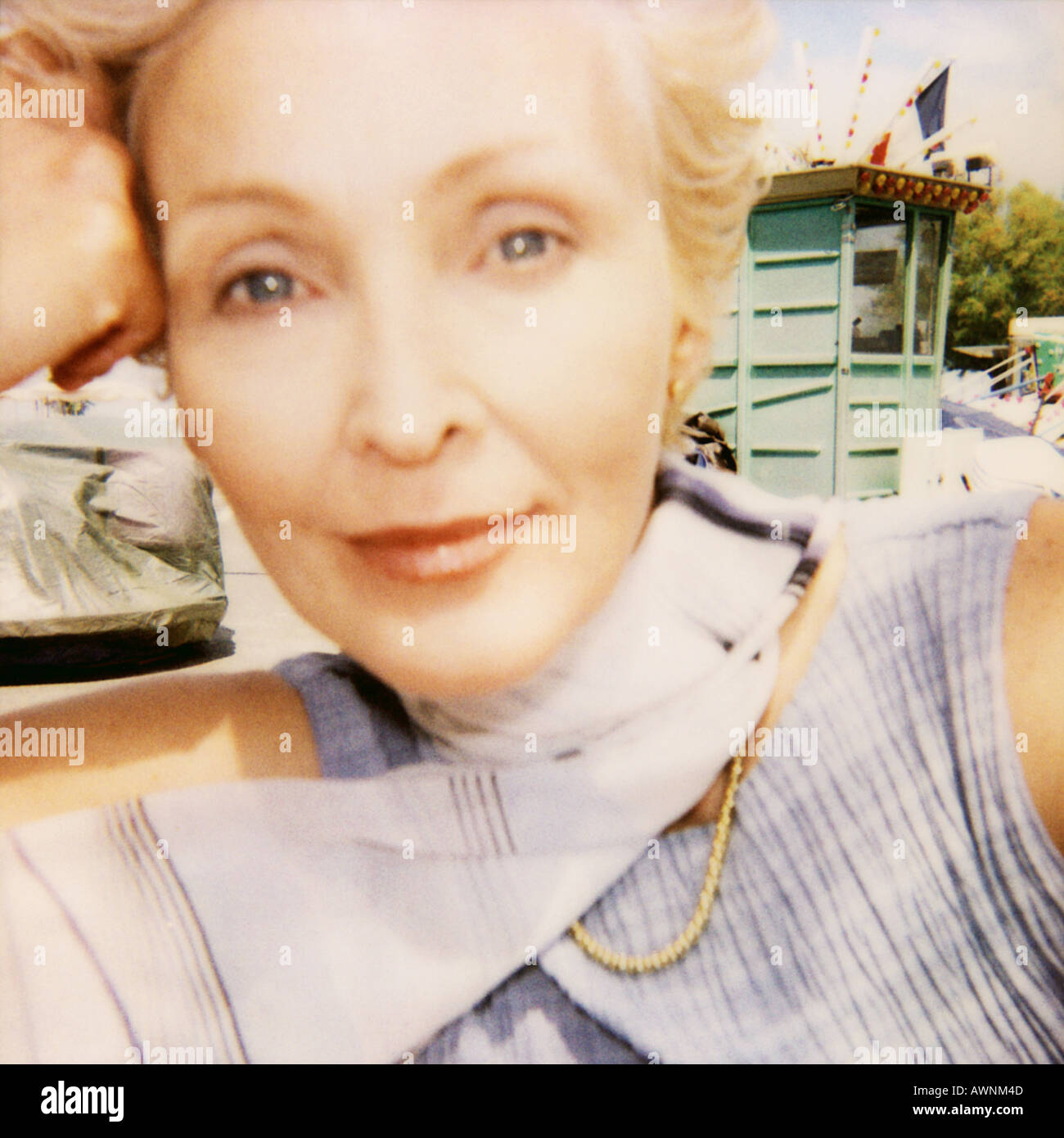 Mature woman, hand to head, close up, portrait, soft focus Stock Photo