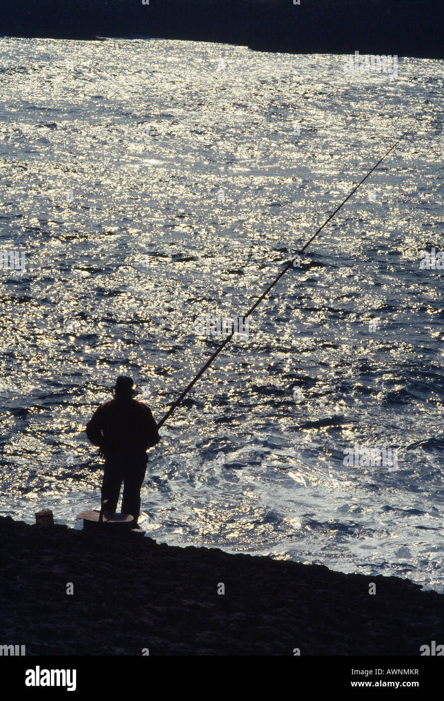 Silhouette of fisherman by the sea. Cape of Ajo. Cantabria province. Spain. Stock Photo