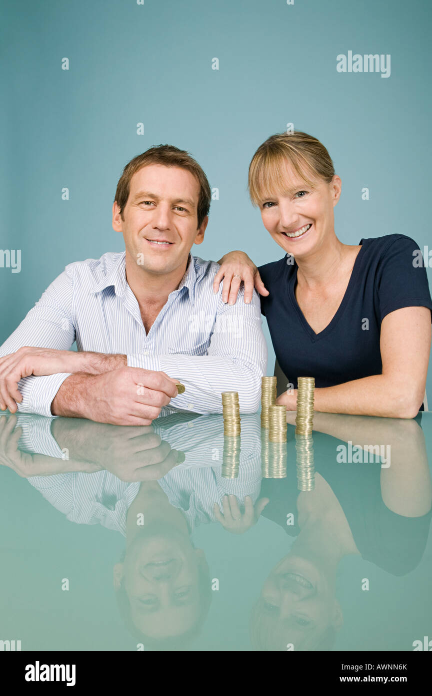 Couple with coins Stock Photo