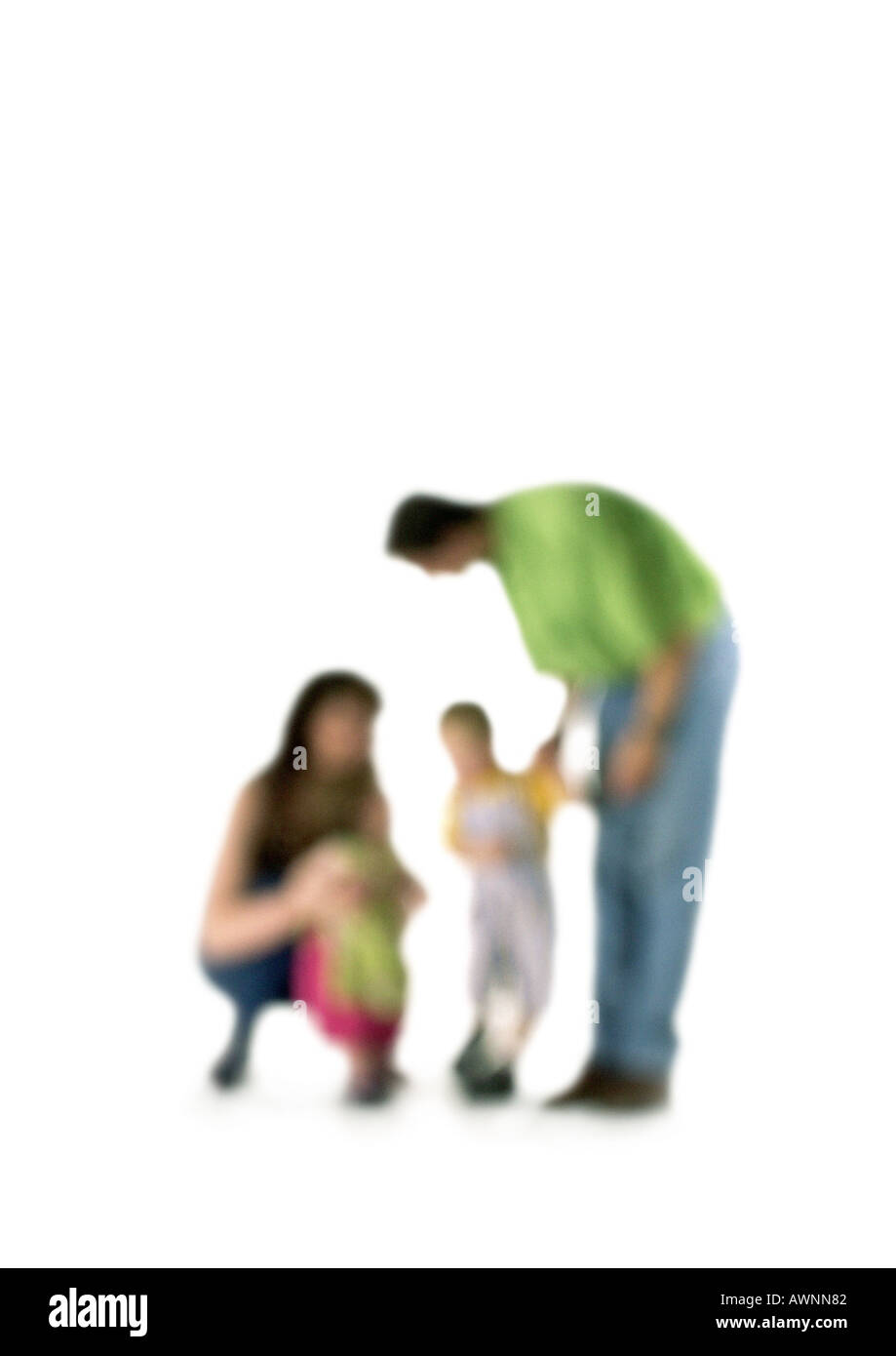 Silhouette of parents speaking to two children, on white background, defocused Stock Photo
