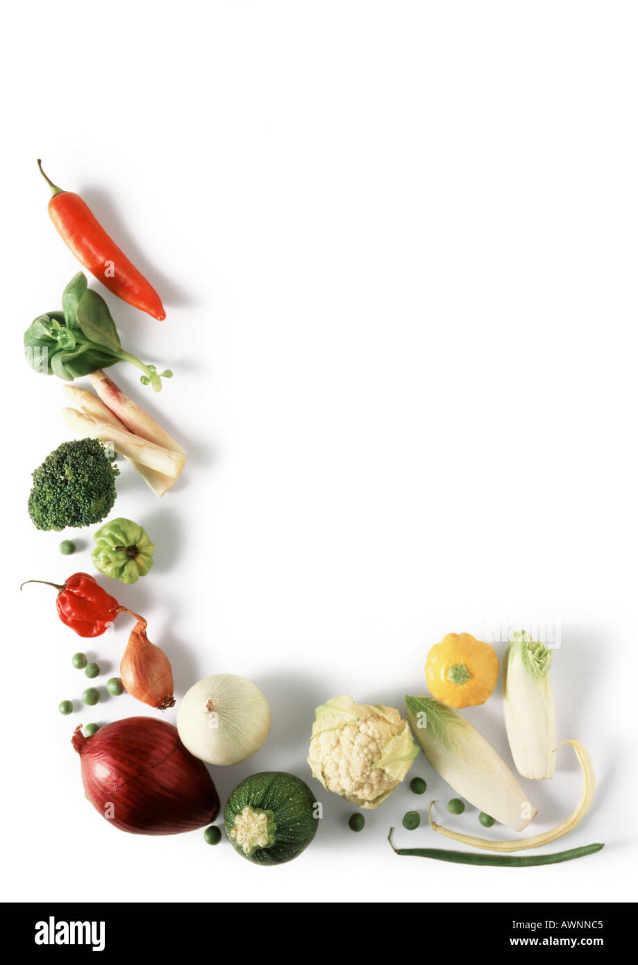 Various vegetables laid out in L shape, high angle view Stock Photo