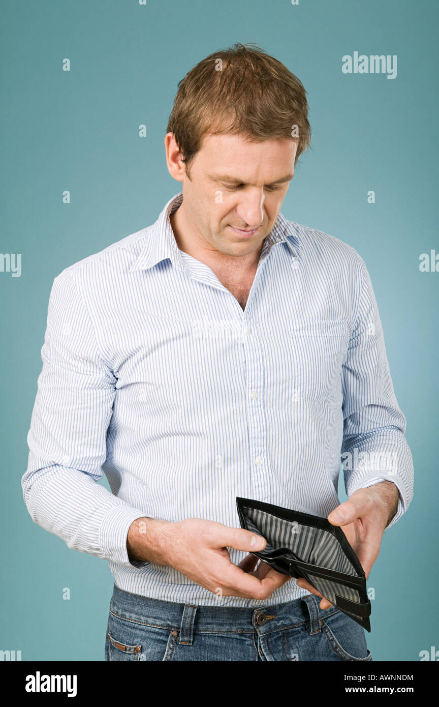 Man looking in wallet Stock Photo Alamy