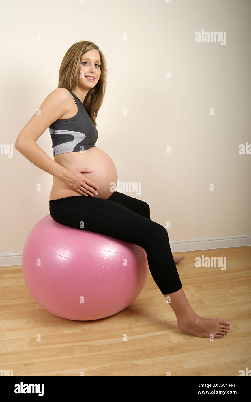Pregnant woman on exercise ball Stock Photo Alamy