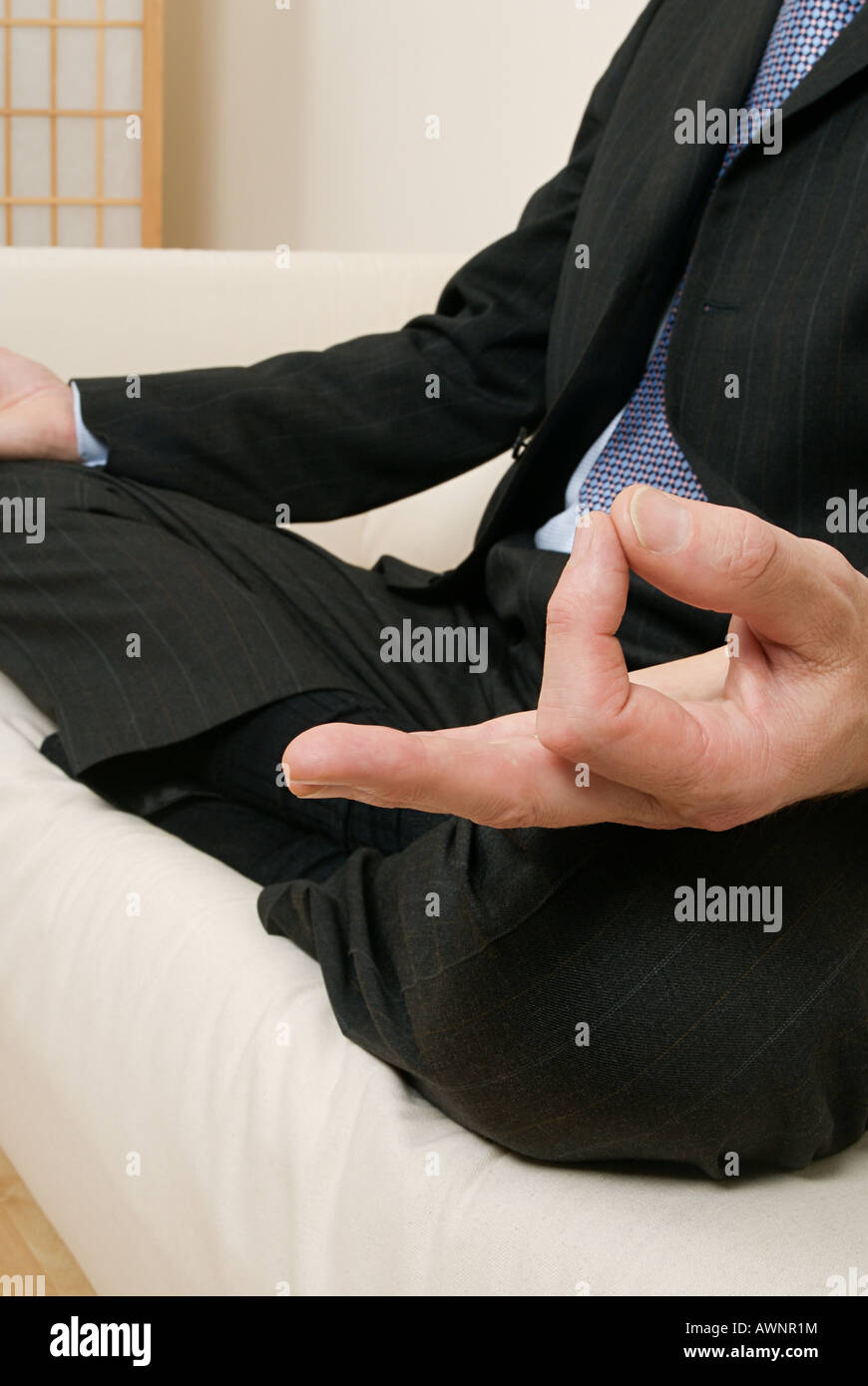 A businessman meditating Stock Photo - Alamy