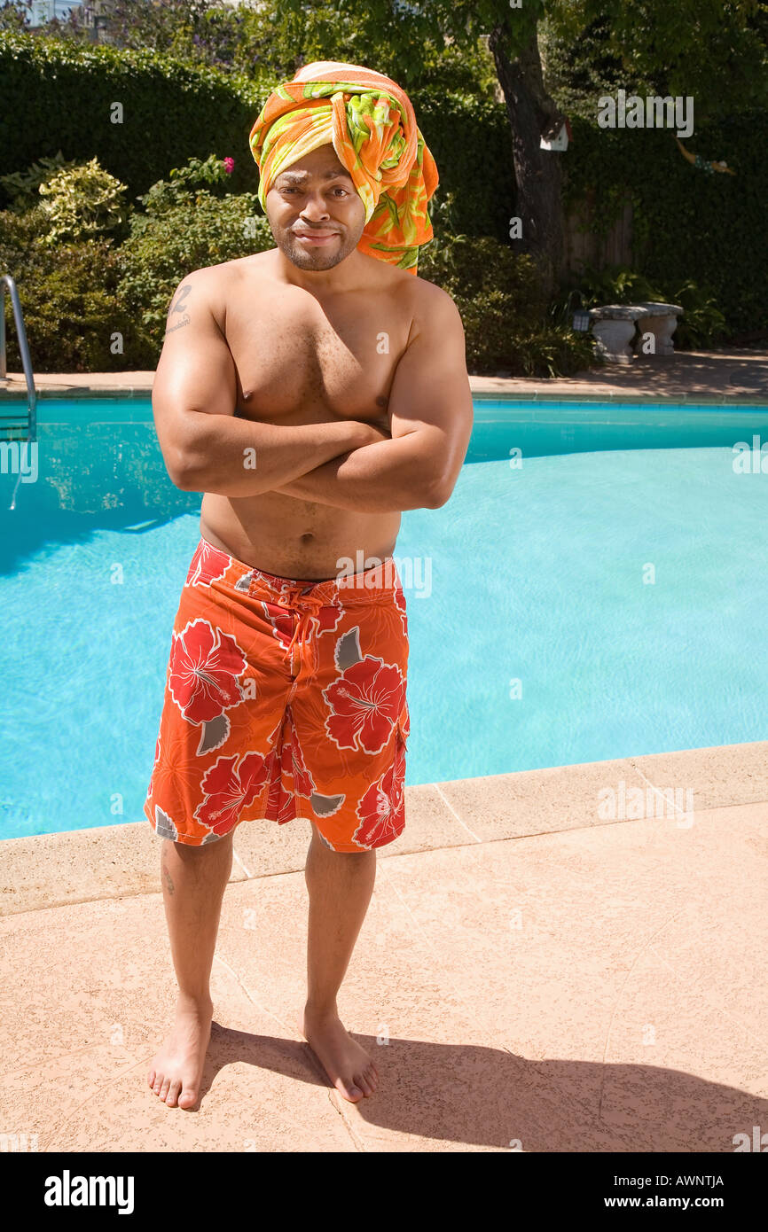 Man wearing towel turban by pool Stock Photo - Alamy