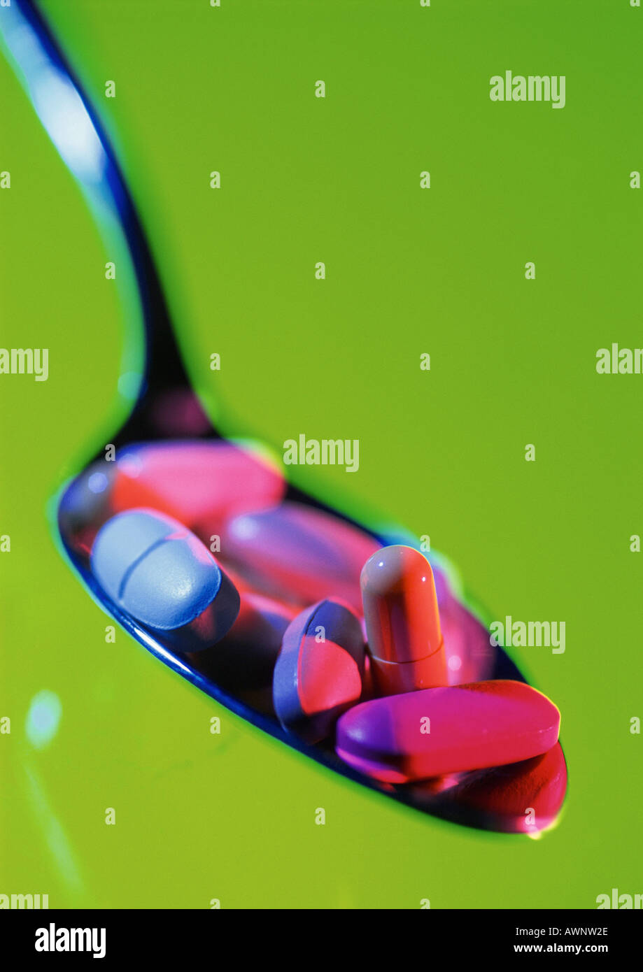 Various pills in spoon, close-up Stock Photo