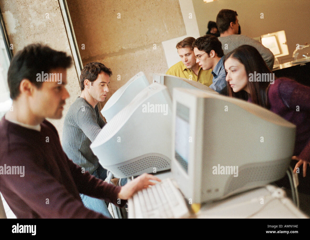 People using computers, side view Stock Photo