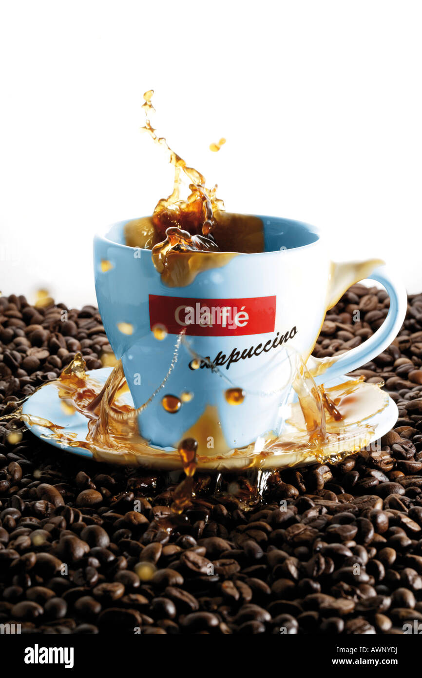 Coffee cup spilling out Stock Photo