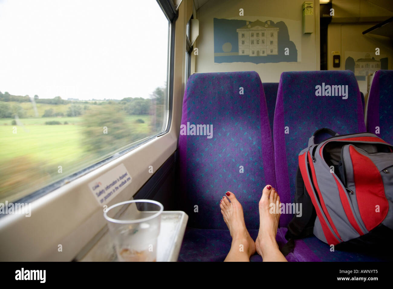 Woman’s bare feet propped up on a train seat Stock Photo Alamy