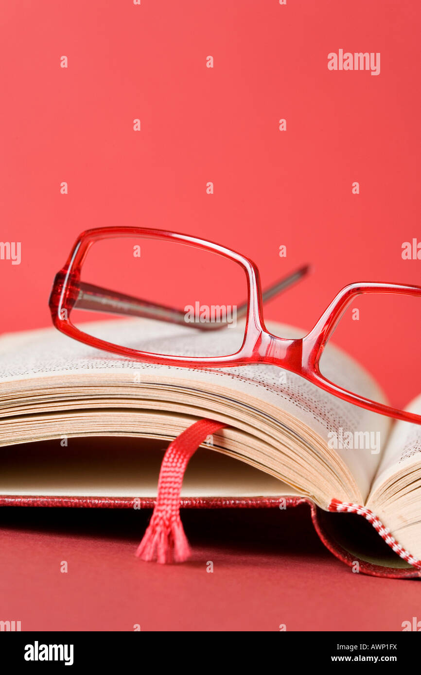 Eyeglasses on a book Stock Photo