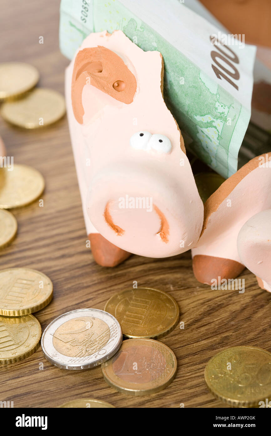 Piggy bank with money Stock Photo