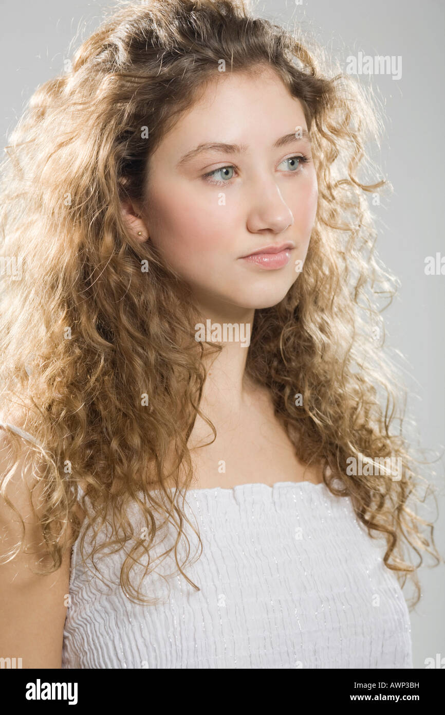 Portrait of a young woman with curly hair Stock Photo - Alamy
