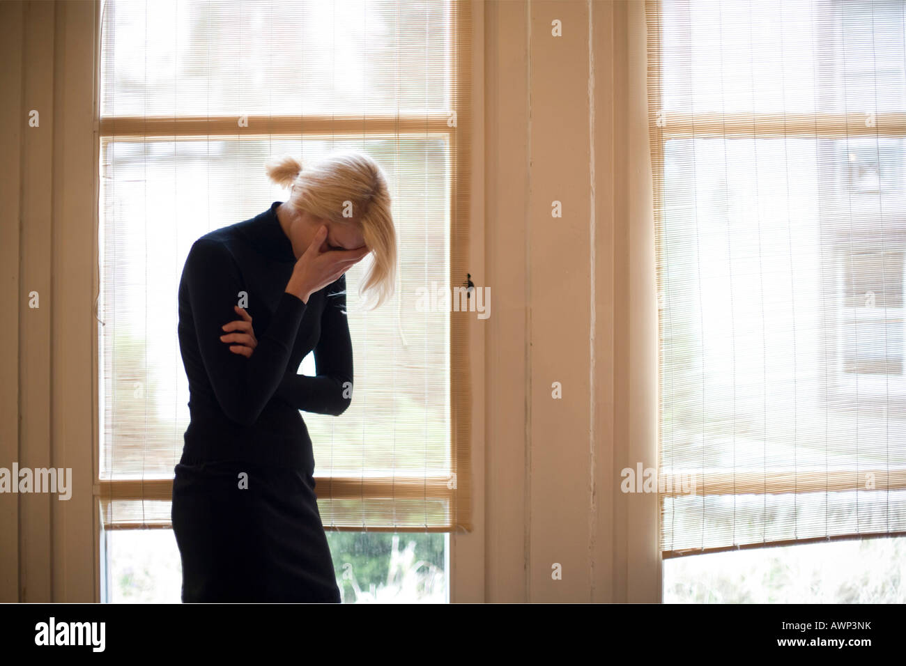 Woman sad tears window hi-res stock photography and images - Alamy