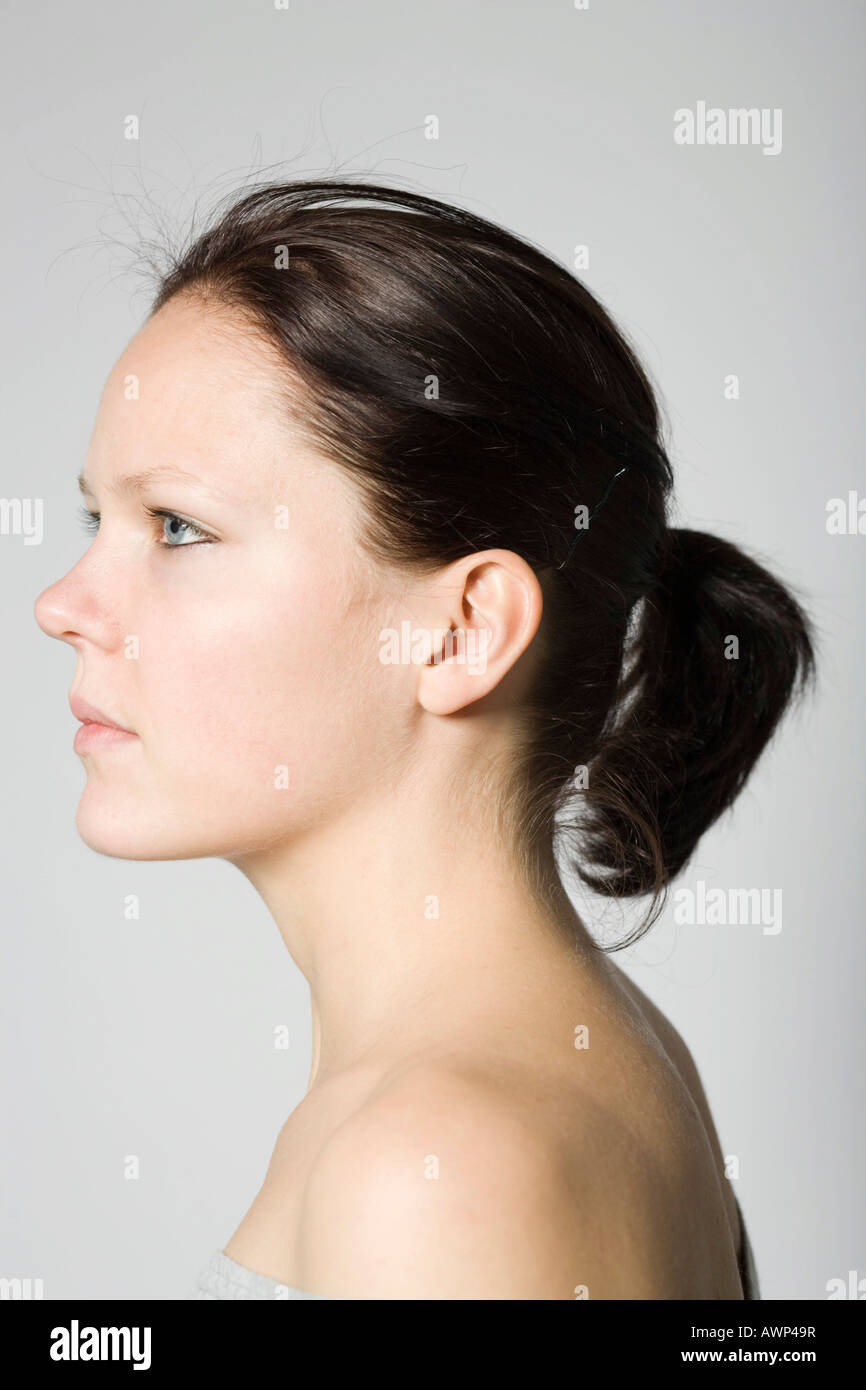 Portrait of a young brunette woman, profile Stock Photo