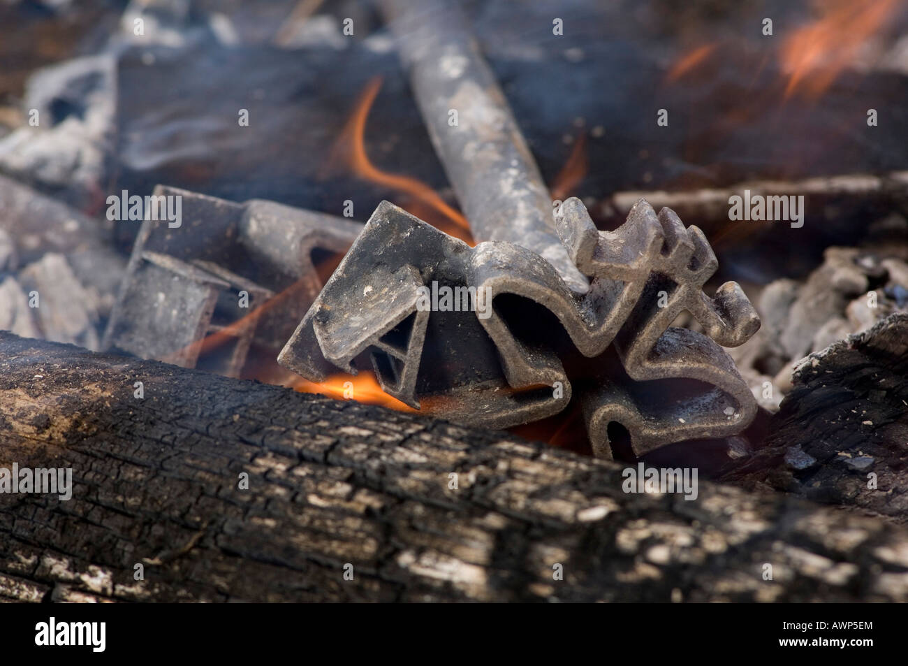 Branding iron, heated in an open fire pit, Costa Rica, Central America Stock Photo