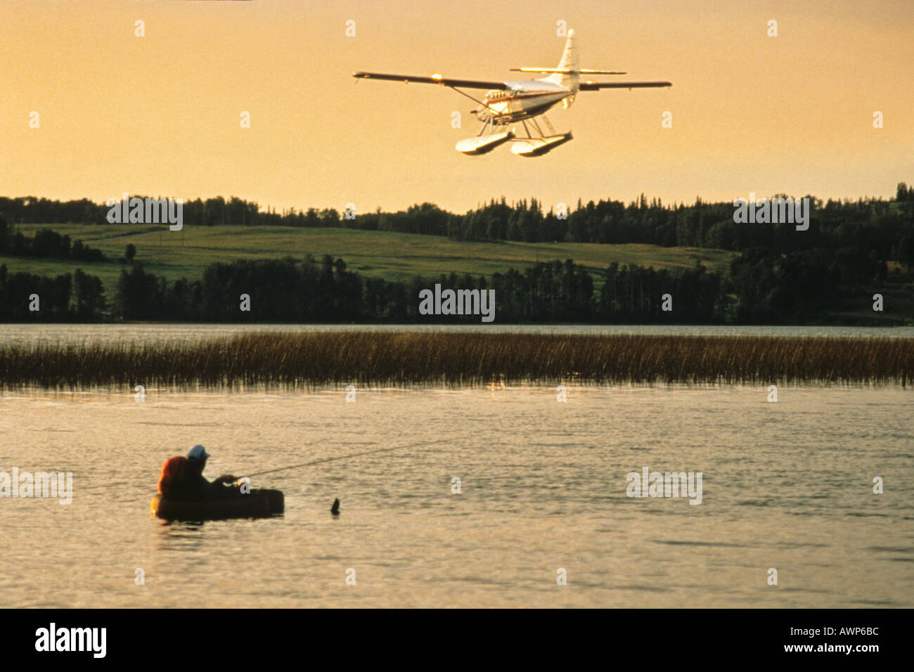 Fisherman and floatplane Stock Photo