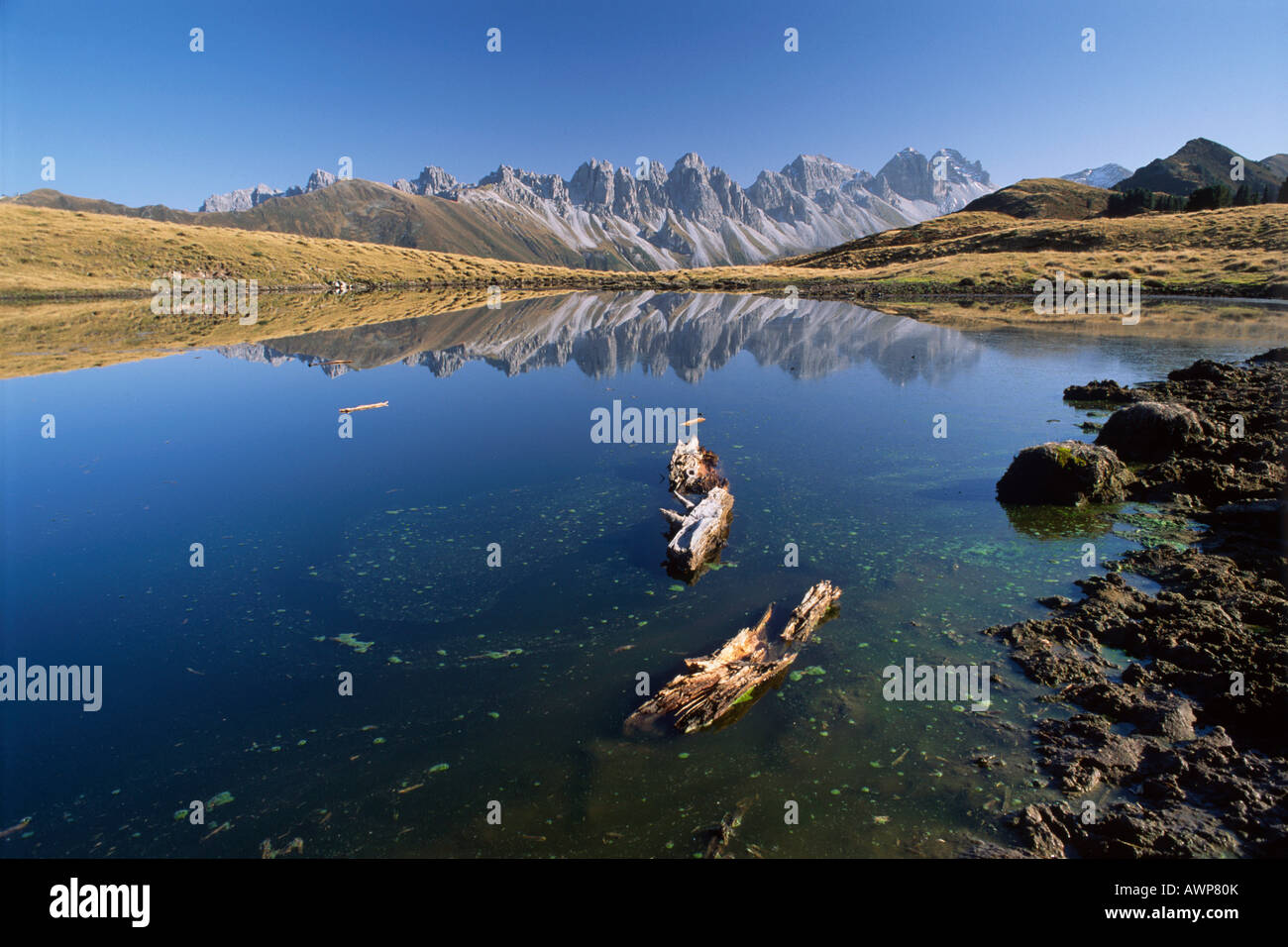 Kalkoegel Mountains reflected in the surface of an alpine lake in autumn, North Tirol, Austria, Europe Stock Photo