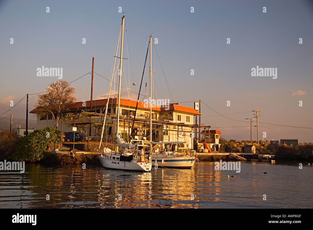 The Charter Desk at the Fuel Dock and sailboats at sunset, Honokohau