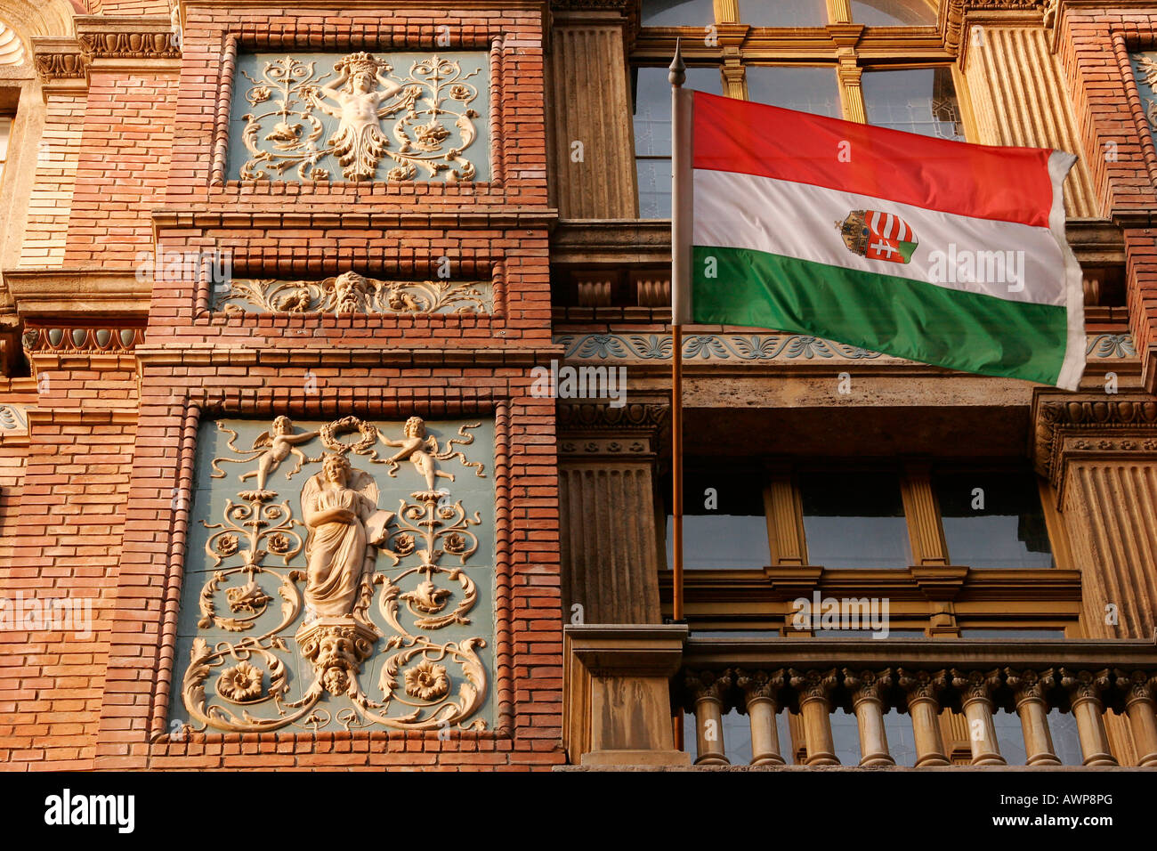 Flag of the Hungarian state on an elaborately decorated facade, Budapest, Hungary, Europe Stock Photo