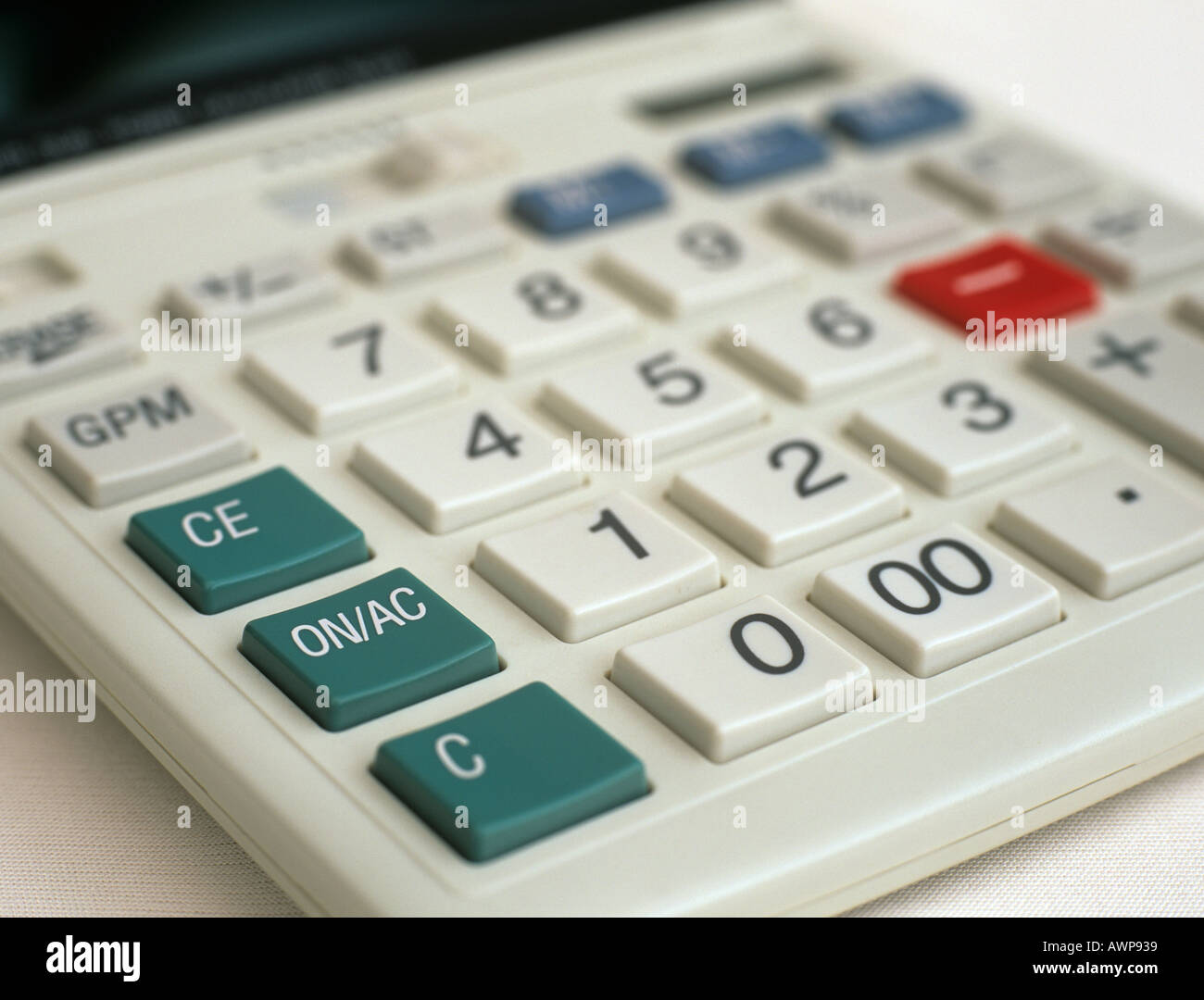 Calculator in close up focused on green ON AC key Studio Still life Stock Photo