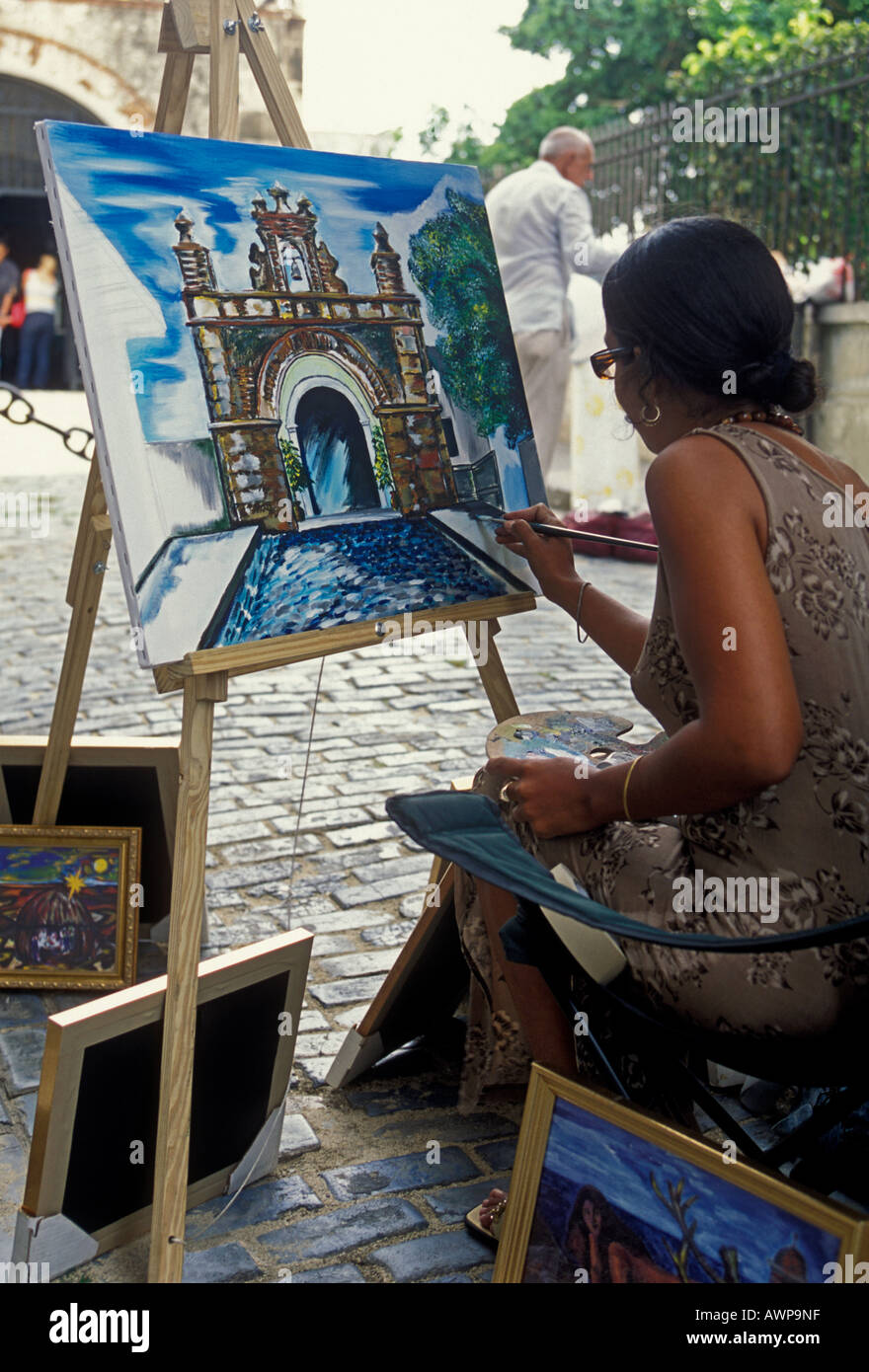 Puerto Rican woman, woman painting, painter, painting picture, Calle del Cristo, Old San Juan, San Juan, Puerto Rico, West Indies Stock Photo