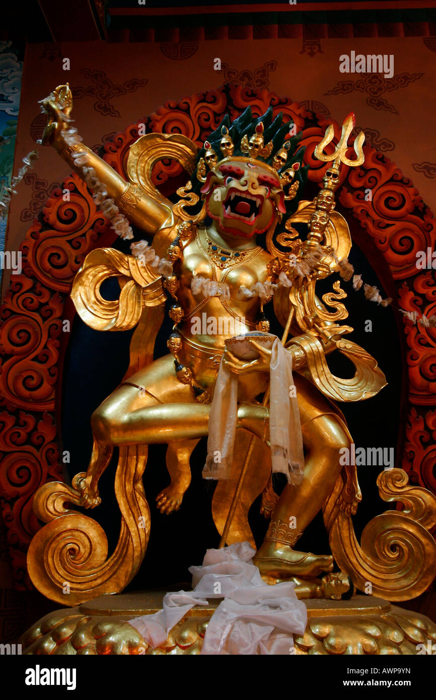 Golden statue of a gruesome demon in a monastery at the stupa near Bodnath, Kathmandu, Nepal, Asia Stock Photo