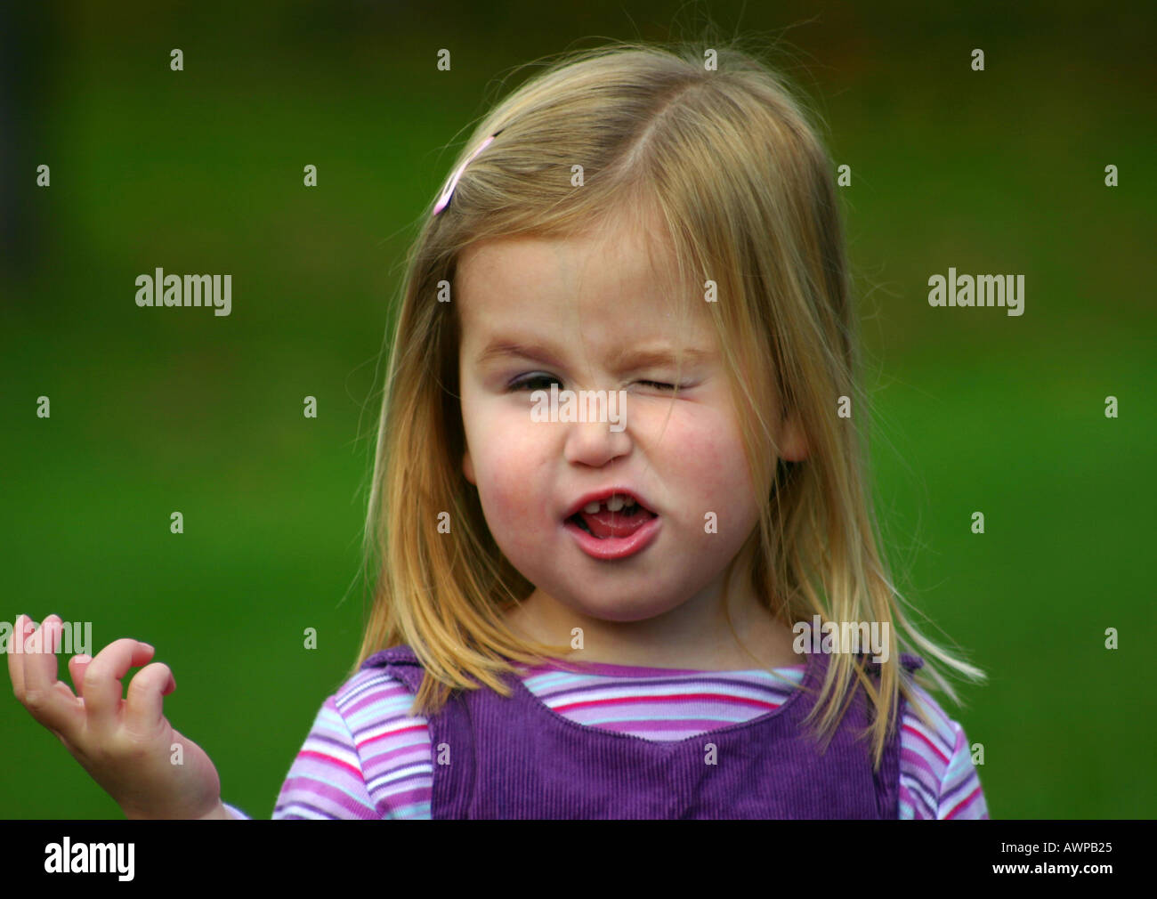 Cute Little Girl Pulling Funny Face Stock Photo Alamy