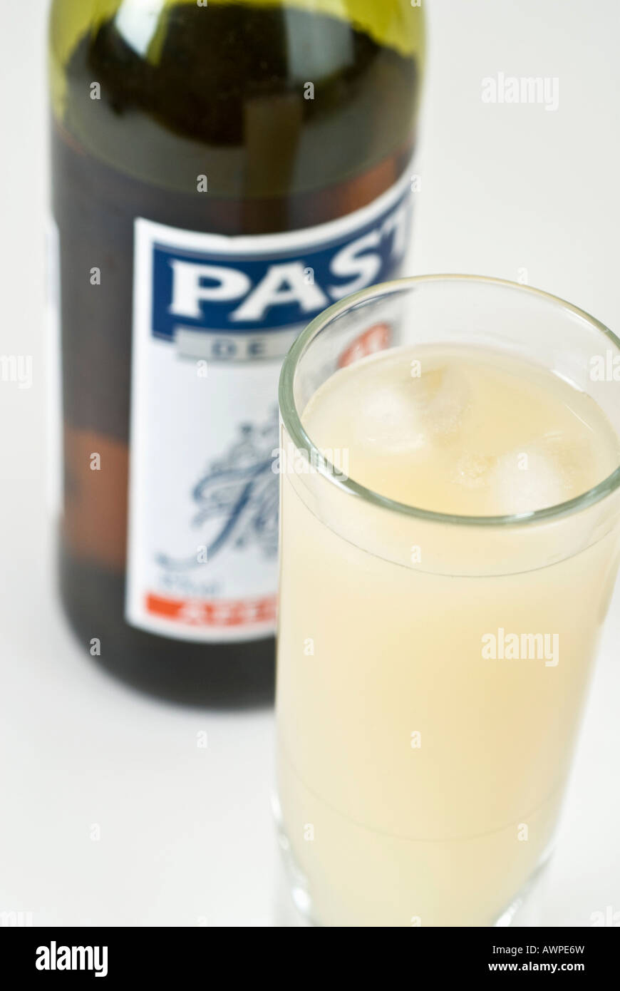 Pastis mixed with water and ice cubes Stock Photo