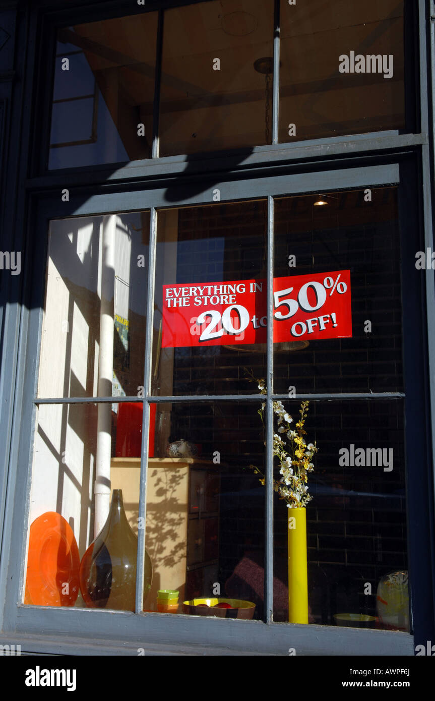 Sale sign in the window of a storefront in the NYC neighborhood of Chelsea Stock Photo