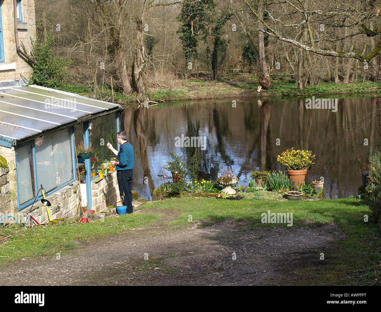 a derbyshire stone cottage beside the river derwent,derbyshire,england