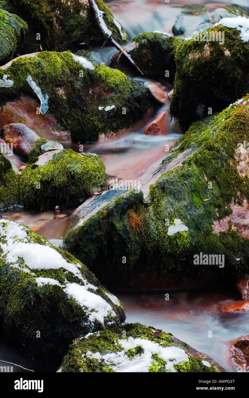 Stream flowing over rocks Stock Photo