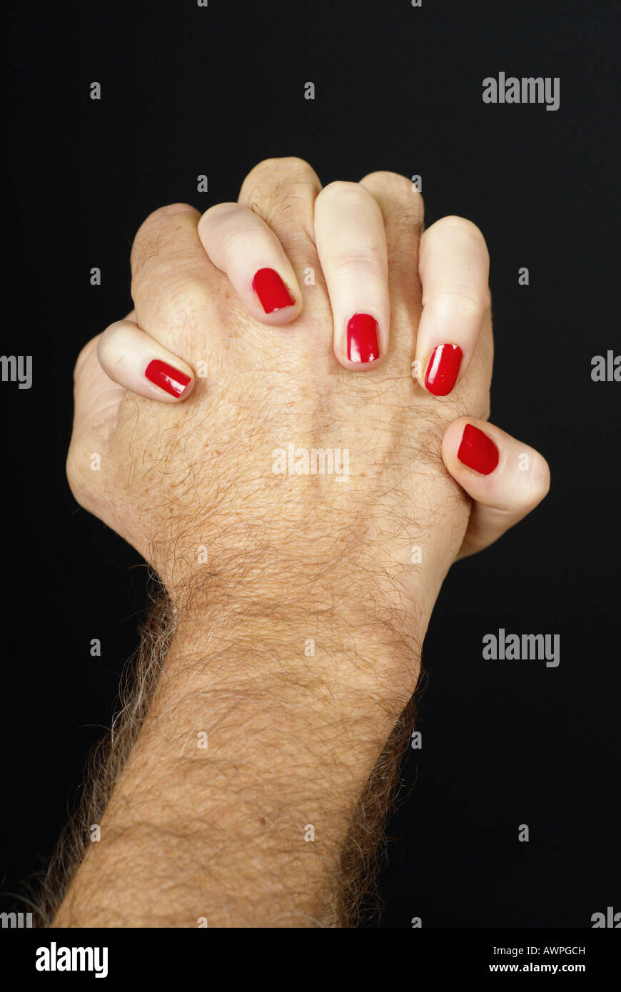 Interlocked hands, man and woman Stock Photo